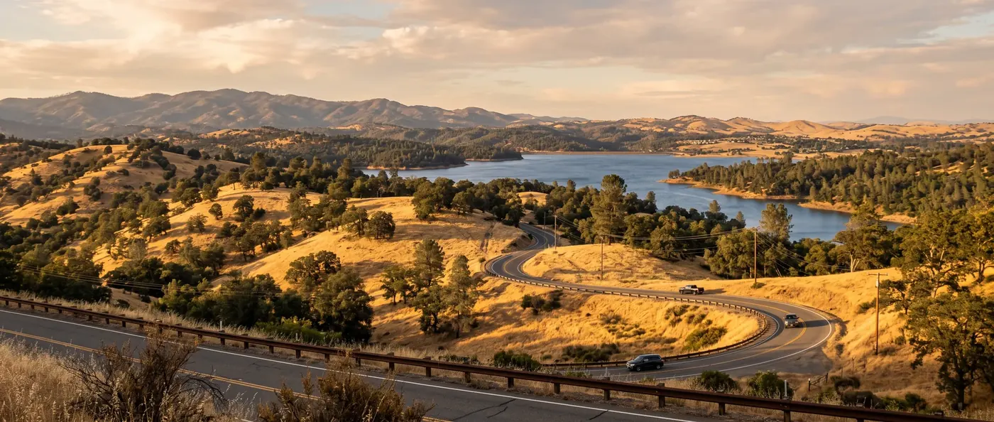 Golden Sierra foothills and a blue reservoir in El Dorado County -- Scharf Law, P.C. serves families across El Dorado County.